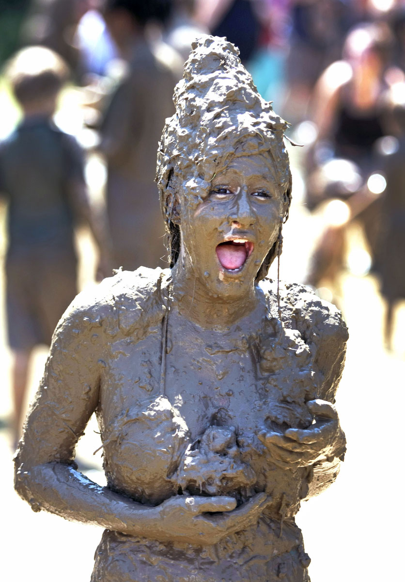 age 13, of Westland, Michigan reacts to being covered with mud by her frien...