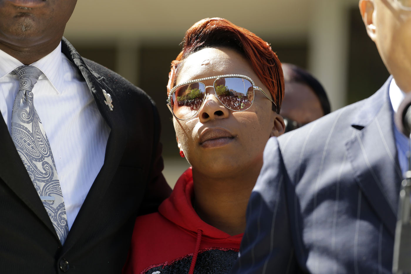 <b>Lesley McSpadden</b>, the mother of Michael Brown, listens during a news <b>...</b> - AP-APTOPIX-Ferguson