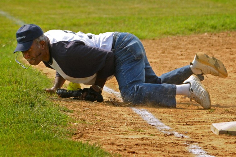 Charlestown third baseman Carlton Butler smothers a single in the first game against Riderwood. (Amy Davis/ Baltimore Sun)