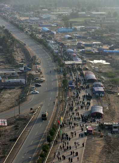 In this Sunday, Nov. 29, 2015, photo, Shiite pilgrims march to Karbala during the Arbaeen ritual in Baghdad, Iraq. (AP Photo/Hadi Mizban)