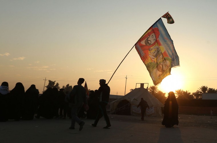 In this Sunday, Nov. 29, 2015, photo, Shiite pilgrims march to Karbala during the Arbaeen ritual in Baghdad, Iraq. (AP Photo/Hadi Mizban)