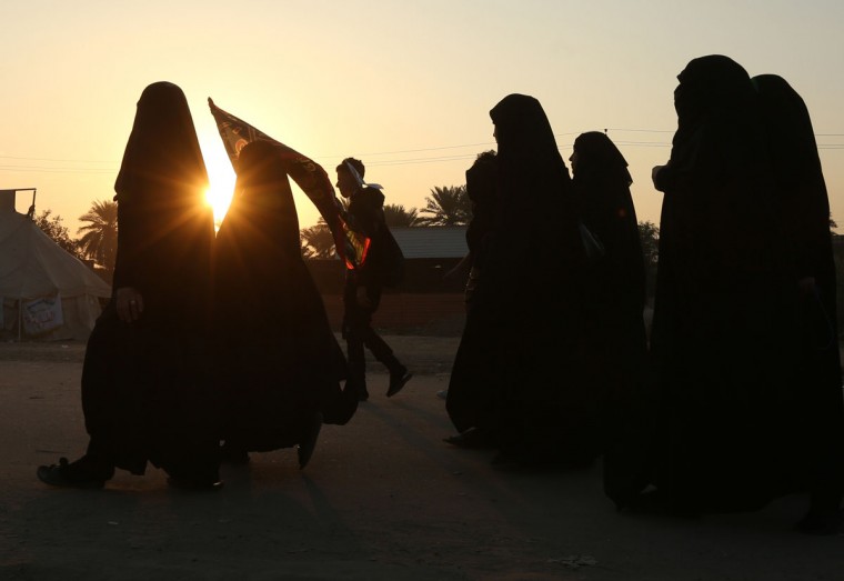 Shiite pilgrims march to Karbala during the Arbaeen ritual in Baghdad, Iraq, Sunday, Nov. 29, 2015. (AP Photo/Hadi Mizban)