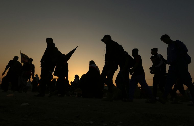 Shiite pilgrims march to Karbala during the Arbaeen ritual in Baghdad, Iraq, Sunday, Nov. 29, 2015. (AP Photo/Hadi Mizban)