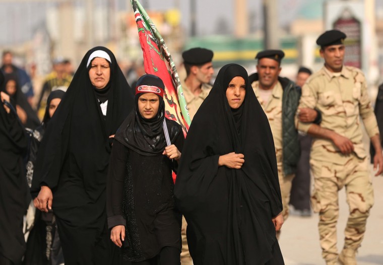 Shiite pilgrims march to Karbala for the Arbaeen ritual in Baghdad, Iraq, Tuesday, Dec.1, 2015. (AP Photo/Hadi Mizban)