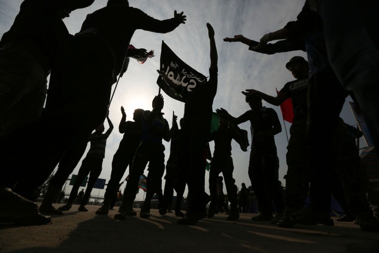 Iraqi Shiite pilgrims participate in the Arbaeen ritual in Baghdad, Iraq, Tuesday, Dec.1, 2015. (AP Photo/Hadi Mizban)