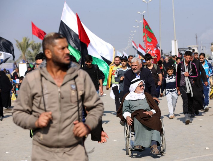 Shiite pilgrims march to Karbala for the Arbaeen ritual in Baghdad, Iraq, Sunday, Nov. 29, 2015. (AP Photo/Hadi Mizban)