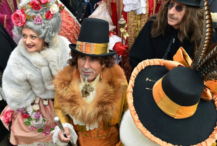 Costumed revellers walks in St Mark's square (Piazza San Marco) after the officially launch of the Venice Carnival on January 31, 2016 in Venice. The 2016 edition of the Venice carnival is untitled "Creatum" and runs until February 9th.(Vincenzo Pinto/AFP/Getty Images)