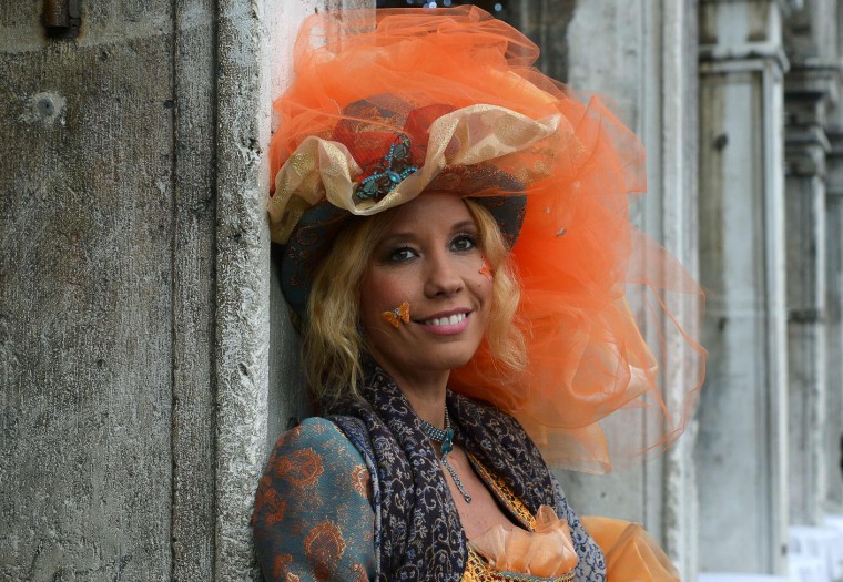 Costumed reveller poses in St Mark's square (Piazza San Marco) after the officially launch of the Venice Carnival on January 31, 2016 in Venice. The 2016 edition of the Venice carnival is untitled "Creatum" and runs until February 9th. (Vincenzo Pinto/AFP/Getty Images)