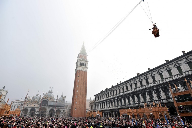 Irene Rizzi performs the "Angel flight" or "Flight of the dove" from the bell tower of Saint Mark's square (Piazza San Marco) to officially launch the Venice Carnival on January 31, 2016. The 2016 edition of the Venice carnival has for theme "Creatum" and runs until February 9. (Vincenzo Pinto/AFP/Getty Images)