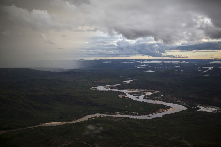 In this Nov. 18, 2015 photo, the Jequitinhonha River snakes across the landscape near Areinha, Minas Gerais state, Brazil. Far into the heart of Brazilís Minas Gerais state, rural miners explore the massive craters left behind by giant mining companies in search of diamonds. (AP Photo/Felipe Dana)