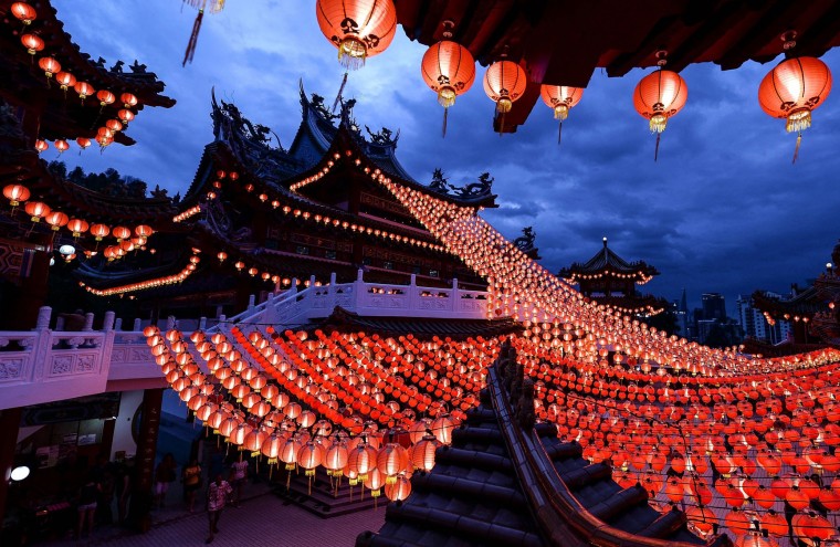 Ethnic Malaysian-Chinese devotees arrive at the Thean Hou temple decorated with red lanterns in Kuala Lumpur on February 7, 2016, on the eve of the Lunar New Year. The Lunar New Year will mark the start of the Year of the Monkey on February 8. (Manan Vatsyayana/AFP/Getty Images)