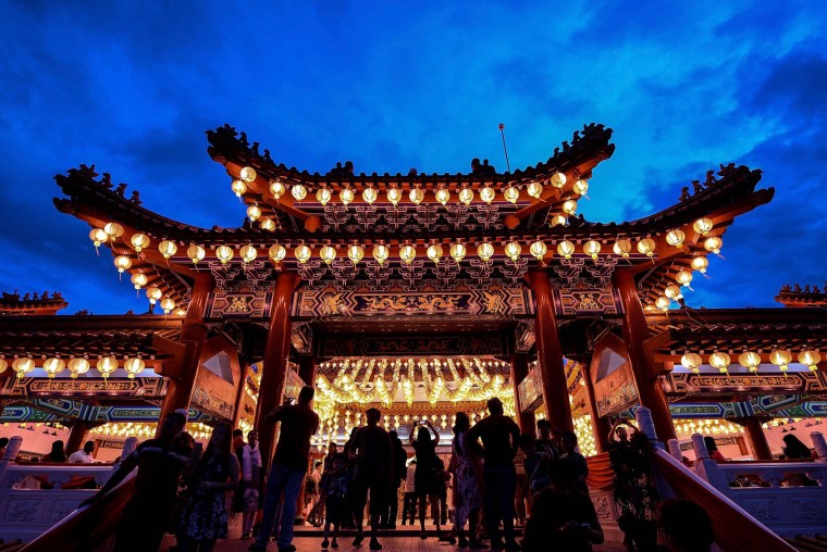 Ethnic Malaysian-Chinese devotees arrive at the Thean Hou temple decorated with red lanterns in Kuala Lumpur on February 7, 2016, on the eve of the Lunar New Year. The Lunar New Year will mark the start of the Year of the Monkey on February 8. (Manan Vatsyayana/AFP/Getty Images)