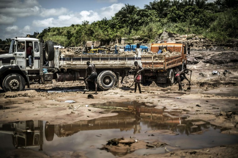 Sand diggers are seen loading trucks at a quarry on the banks of the Congo river in the Kombe district of Brazzaville on March 28, 2016. (MARCO LONGARI/AFP/Getty Images)