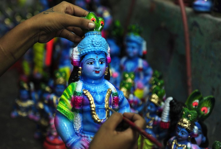 A Indian women worker gives finishing touches to a idol of Hindu god Krishna at a workshop on occasion of 'Krishna Janmashtami' in Chennai on August 20,2016. Brithday of Indian Hindu God Krishna is celebrated as'Krishna Janmashtami' by hindus all over world on 25th of August. (Arun Sankar/AFP/Getty Images)