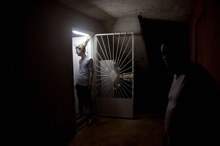 A young man in costume arrives for a Halloween party at a residence in Havana, Cuba, late Friday, Oct. 28, 2016. Inspired by pirated U.S. movies and television shows, young Cubans are turning American-style Halloween parties into the island's latest trend. (AP Photo/Ramon Espinosa)