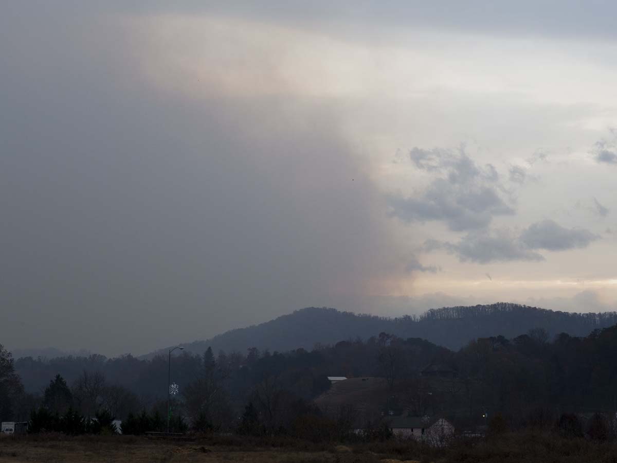 Smoke rises from the Great Smoky Mountains as seen from Pigeon Forge 