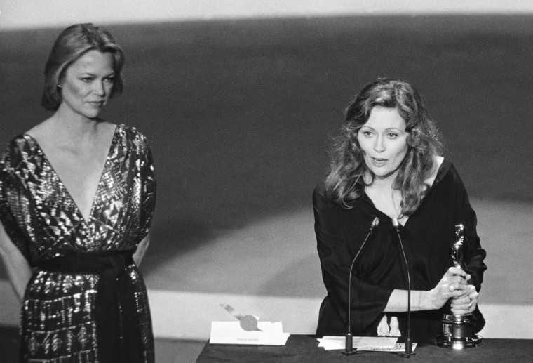 Actress Faye Dunaway, right, wins the best actress award at the Academy ...