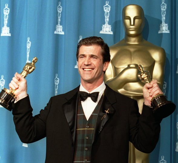 Mel Gibson holds his two Oscars for Best Director and Best Picture for the film "Braveheart" backstage at the 68th Annual Academy Awards March 25, 1996, in Los Angeles. (AP Photo/Damian Dovarganes)